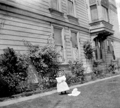 Pic, Girl in side yard of house, probably an Oullahan relative